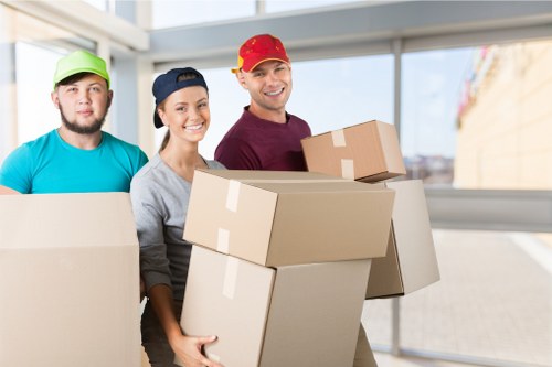 House removals planning in Barkingside with moving boxes and local street setting