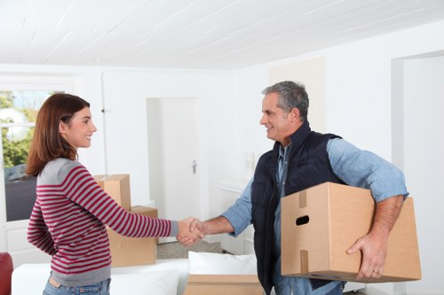 Movers handling furniture during a Barkingside local relocation