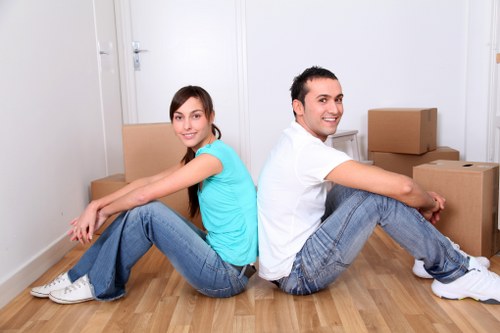 Helper carrying boxes for a flat move in Barkingside
