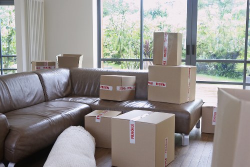 Packed office boxes and furniture prepared for a Barkingside move