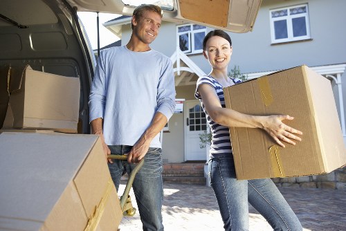Professional movers handling furniture during a small removal in Barkingside